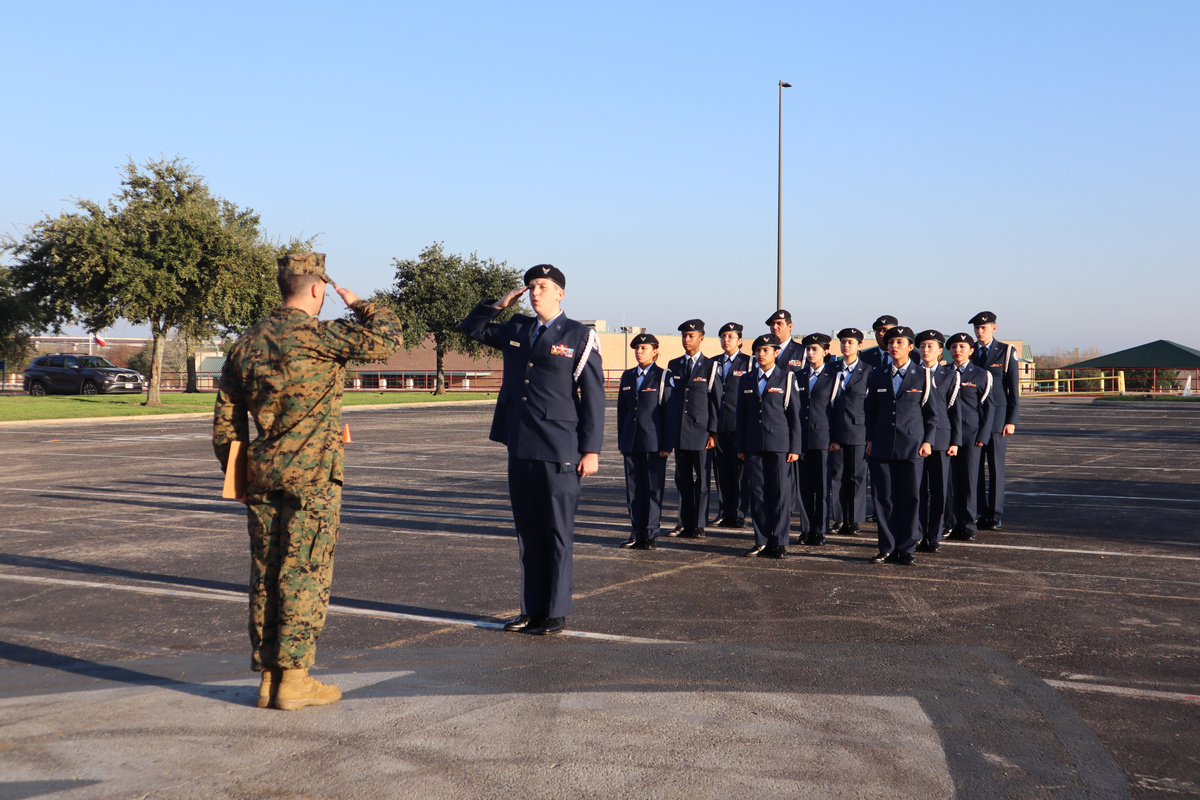 drill team standing in formation with saluting 