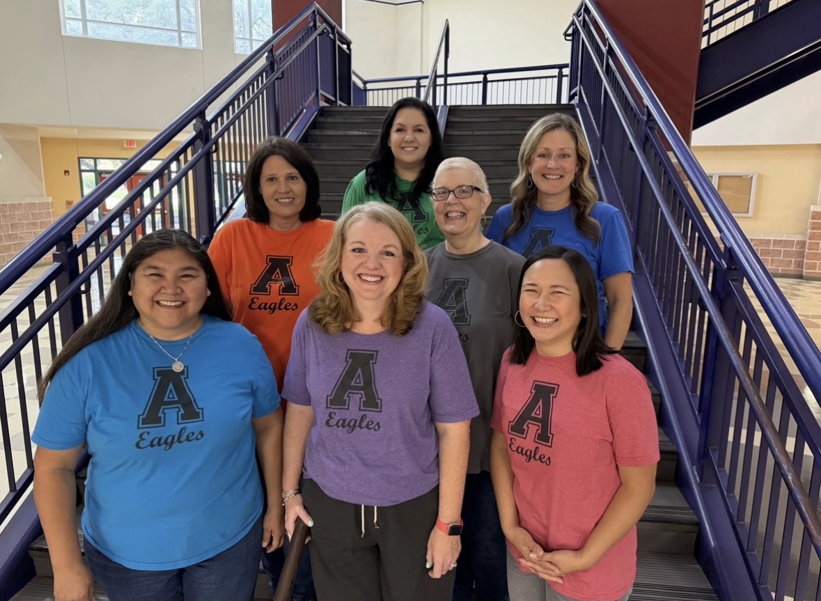 This image is of the 7 Akins Counselors standing up in the main hallway.